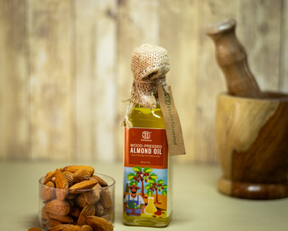 Nutriwood Wood Pressed Almond Oil | Pure Cold Pressed Oil | Pure, Natural |Traditional Wood Pressed |  Kolhu/Kacchi Ghani/Chekku |Fights Split Ends & Strengthens Hair | Enriched With Vitamin E | Mineral Oil Free | 100 mL